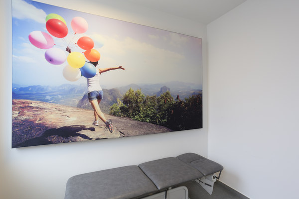 COUSTpanel with the picture of a young woman running in the mountains